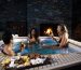 Stylish hot tub Vortex Ikon™ with food platter and socialising